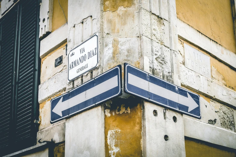 two signs are posted next to a building