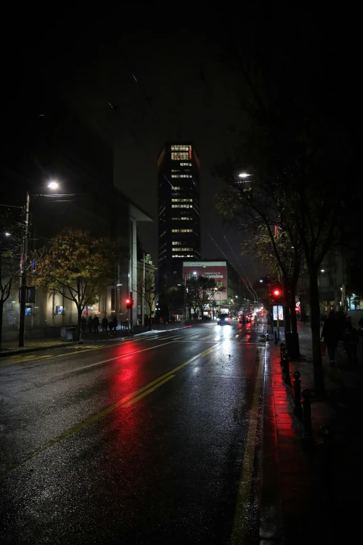 some cars and lights are shining on the street