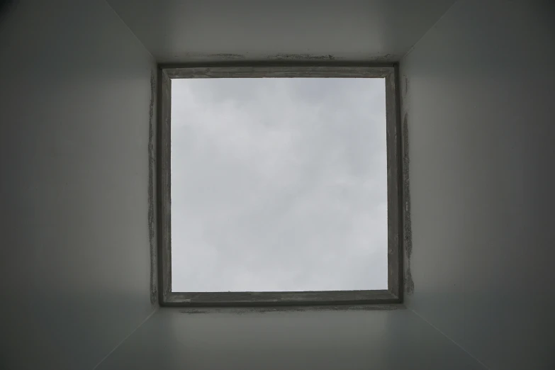 an empty square window on the wall