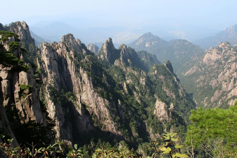 a mountainous area with high mountains, green vegetation and greenery