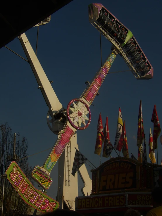 a clock that is on the side of a fair ride