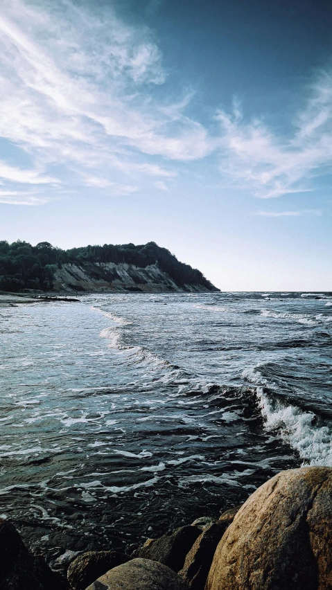 a boat sailing in the water at the ocean