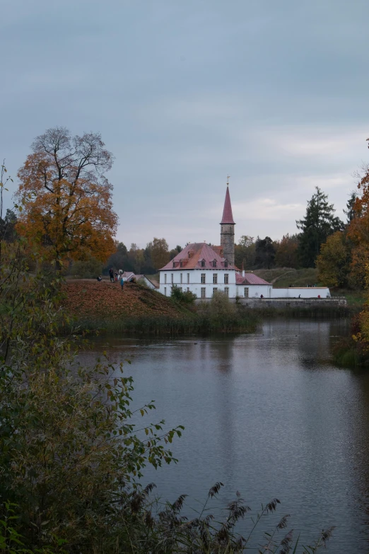 there is a boat in the water in front of an old building