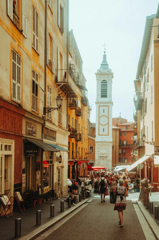 the street is crowded with various shops and stores