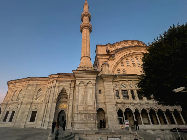 an old stone church with a massive clock tower