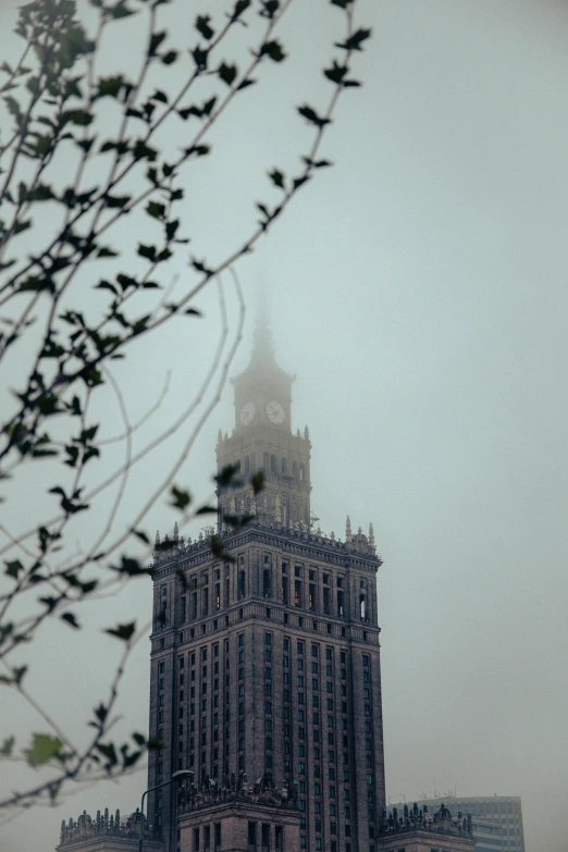 an image of a tall clock tower in the rain