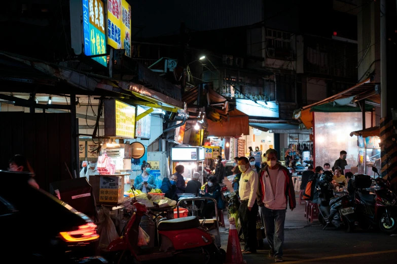 a crowded street at night during the night