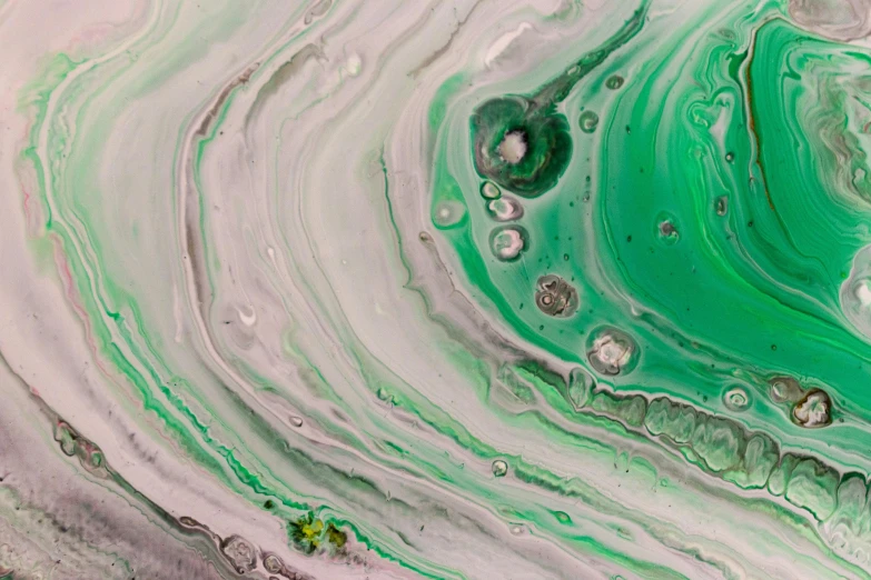 a green and white art object that is floating