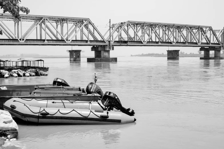 an inflatable float rests next to a large bridge