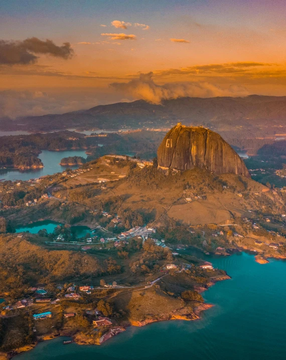 a sunset aerial view of an island and ocean