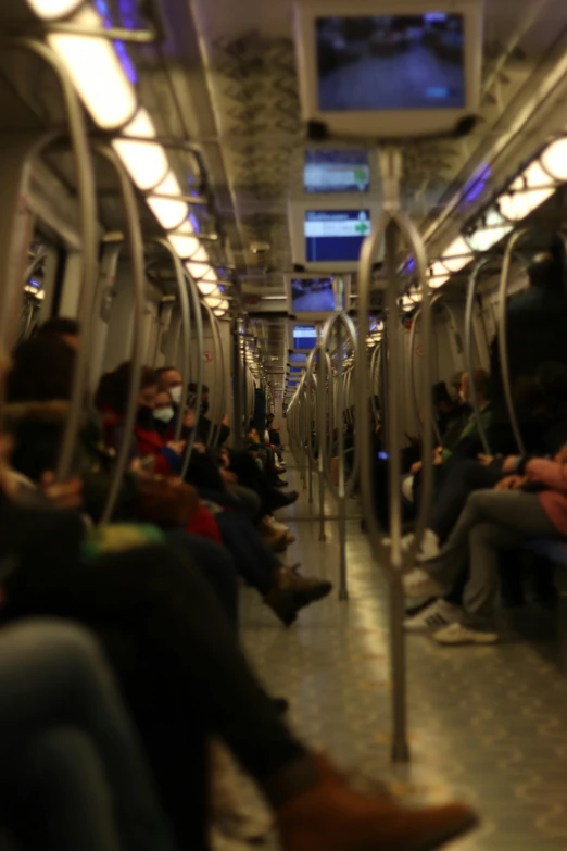 many people are riding the subway on their seat