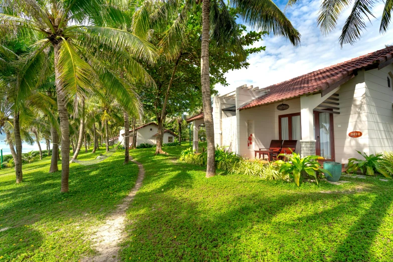 a small building sitting on top of grass covered ground