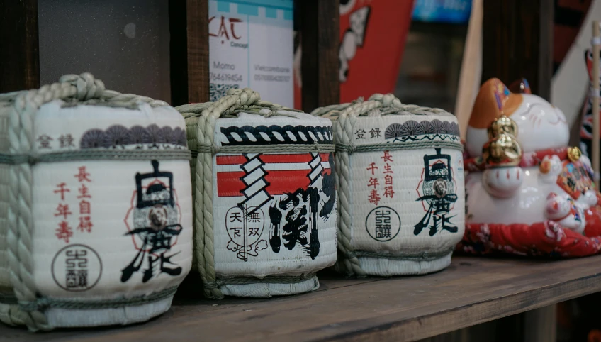 five bags with asian designs and writing on them