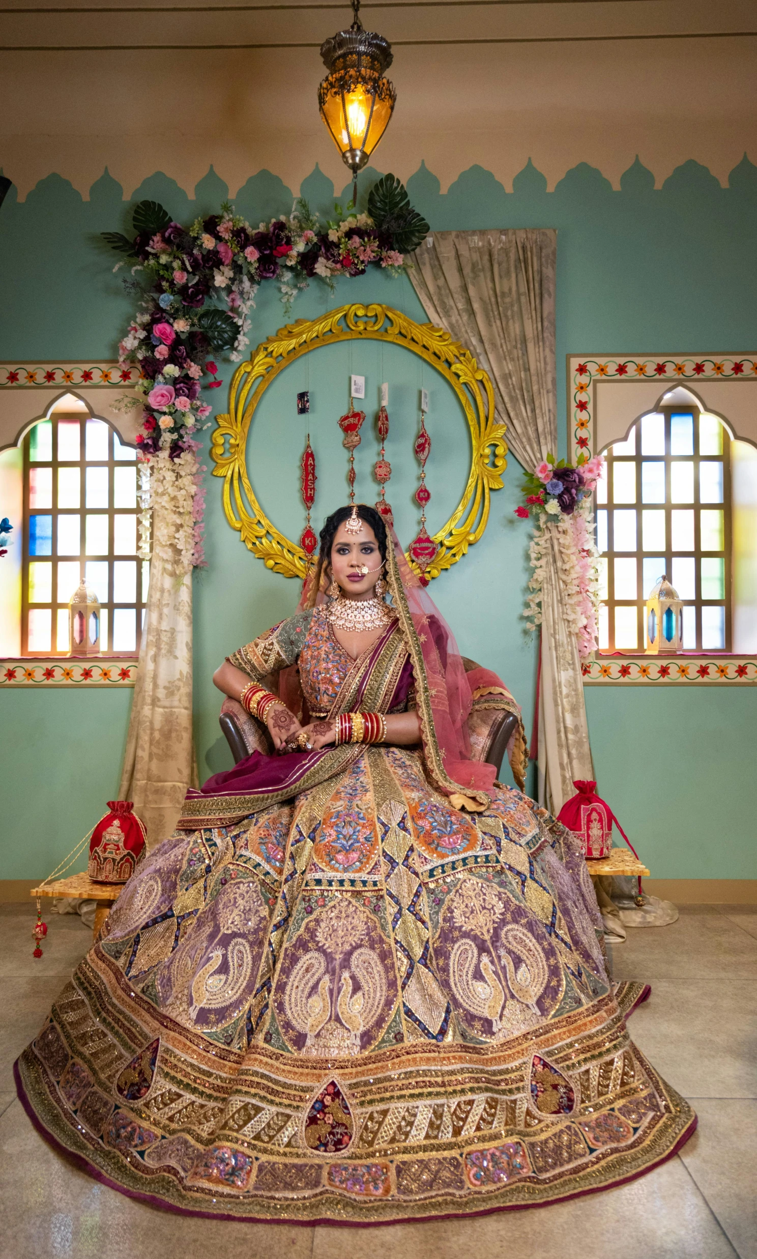 a woman in a bridal gown sitting on a bed