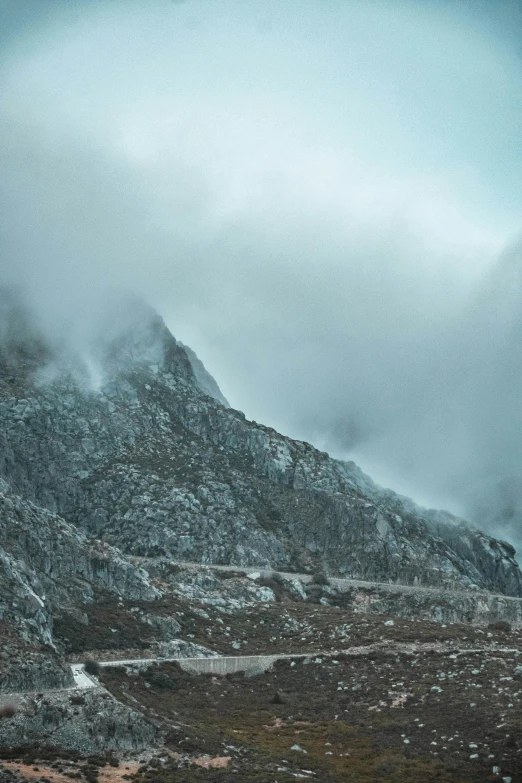 a mountain that is covered in some fog