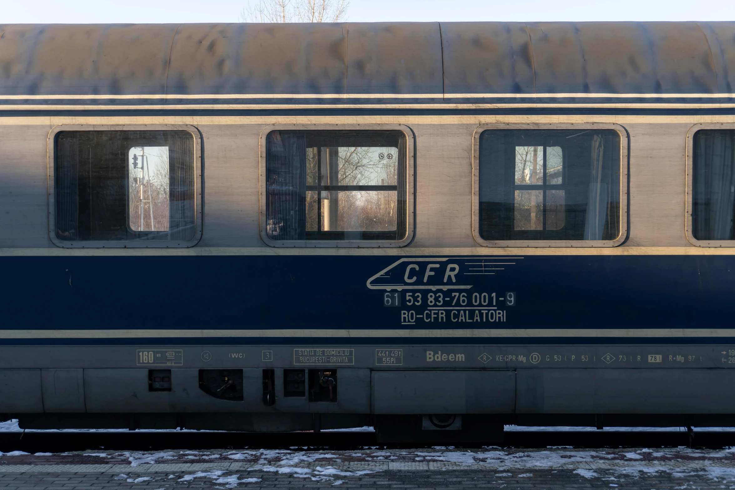 a train that has windows and a sign on it