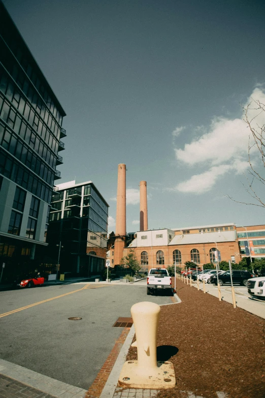 a road view of two brick buildings near one another