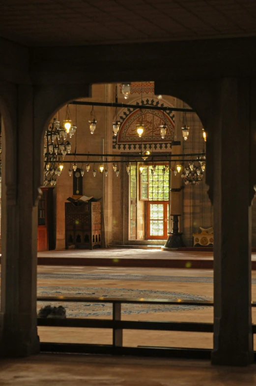 an old wooden church has chandelier hanging from it