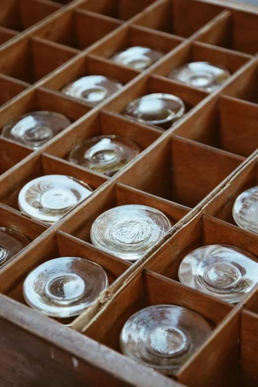 an open drawer containing empty glass plates