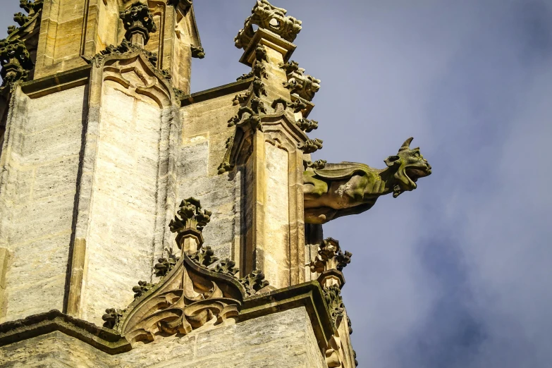 an elaborate and architectural building with a dragon statue on top