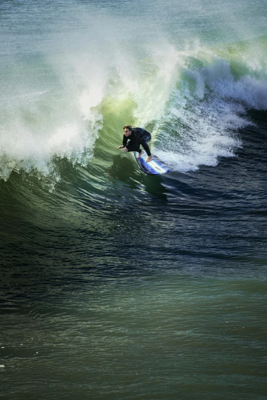 a man on a surfboard riding a wave