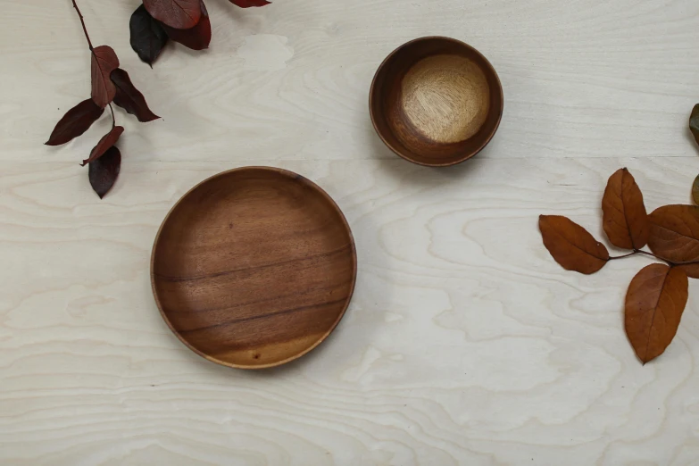 three wooden bowls with various shapes and sizes