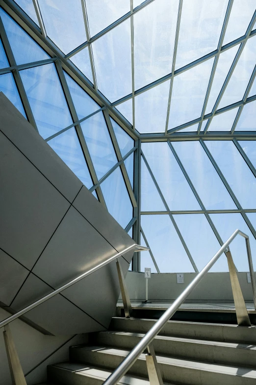 glass walkway going down to the top of stairs