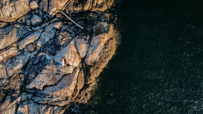 the rocky shoreline in a body of water