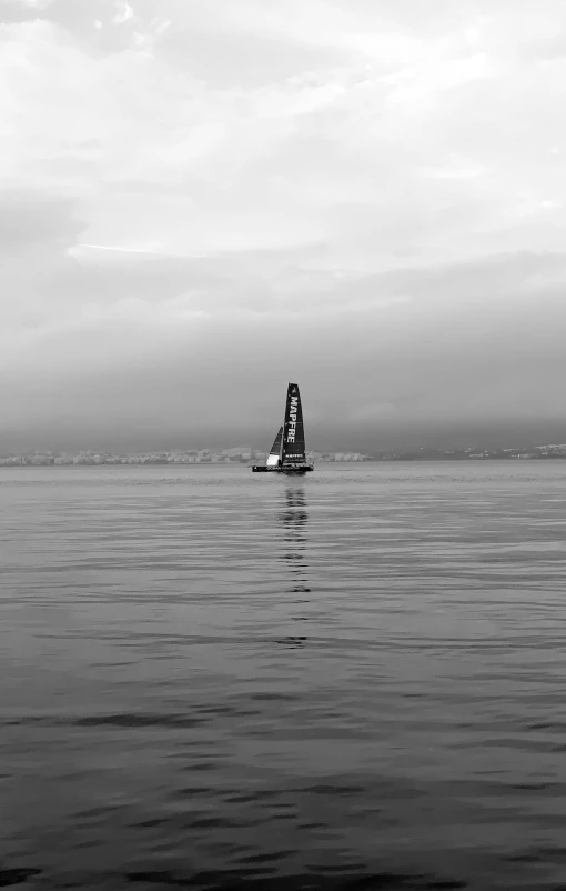 an outrigger boat heading out to sea on calm day