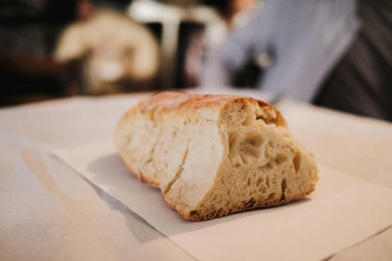 a loaf of bread with a piece of white bread on top