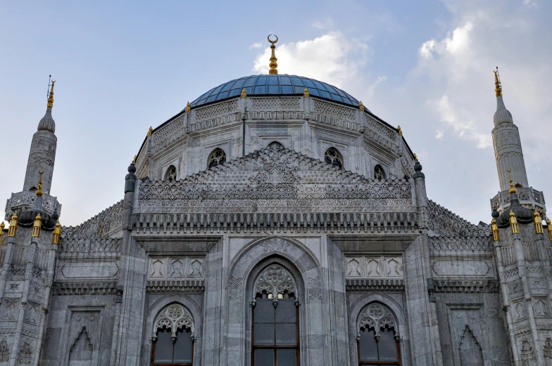 an ornate architectural design on the top of a building