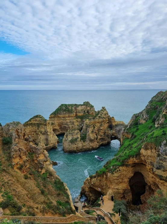 an aerial view of the coast and ocean with rocks in it