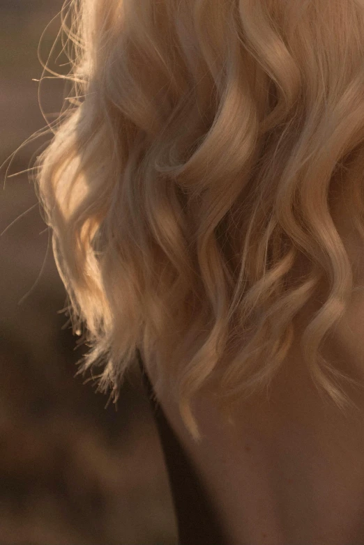 a close up view of a woman with long blonde hair