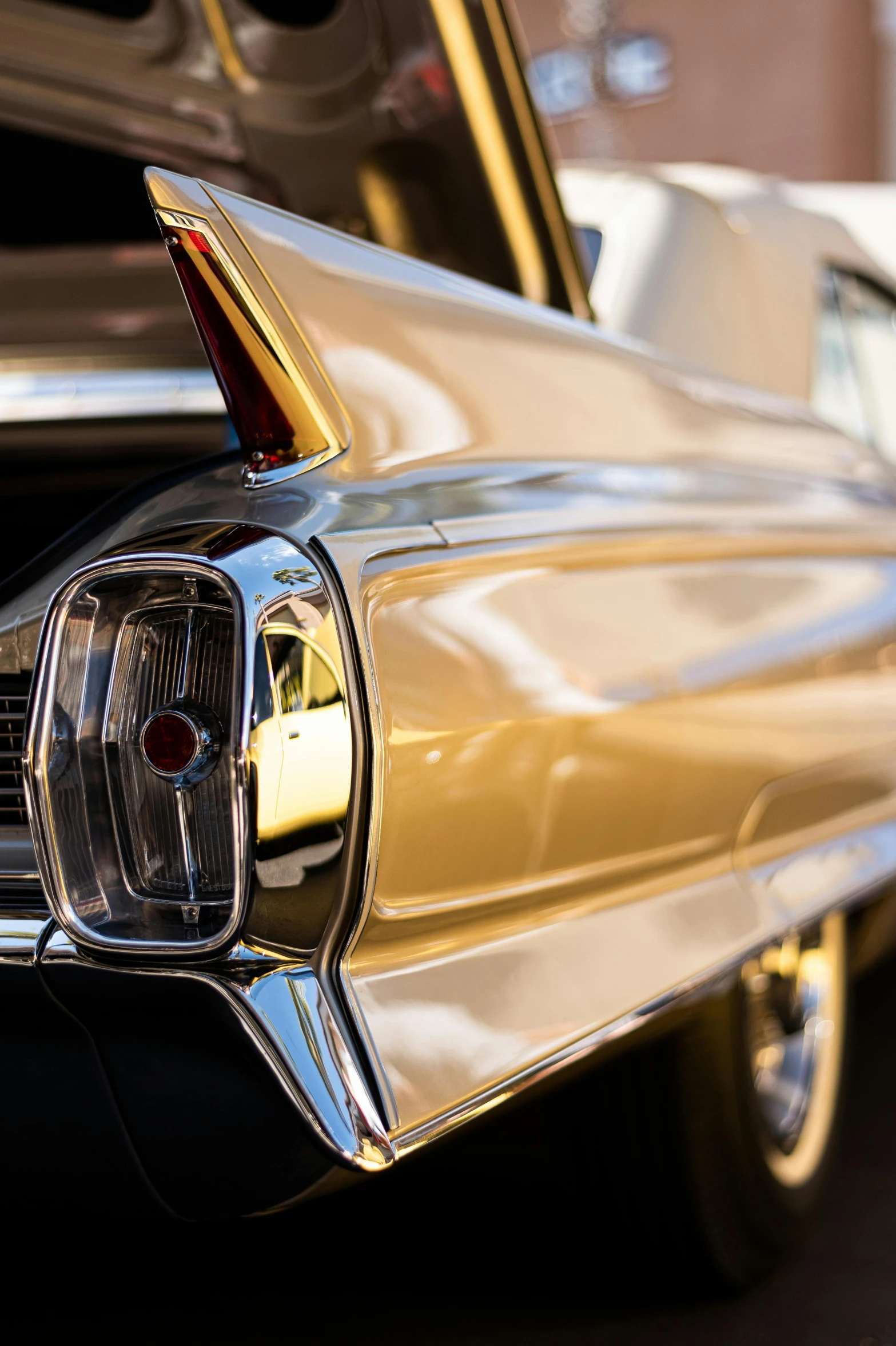 the front end of a gold and chrome car