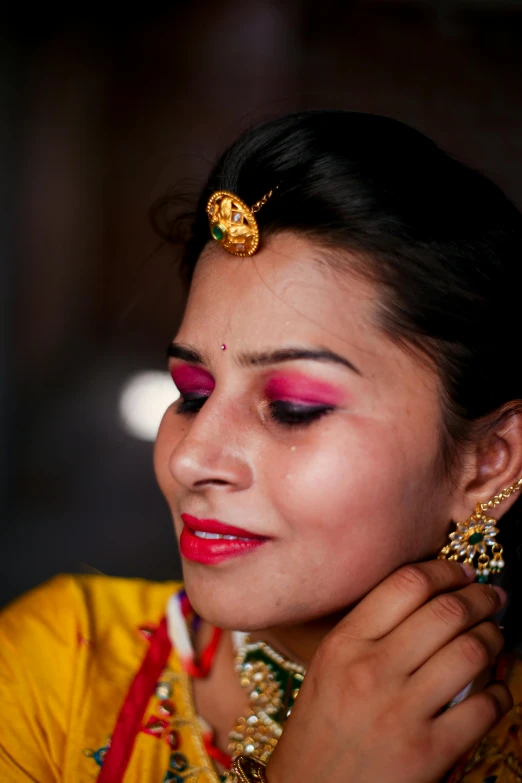 the girl is dressed in traditional indian garb