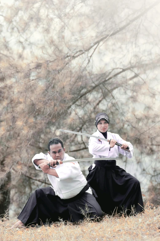 two people wearing hanbois, holding knives and fighting