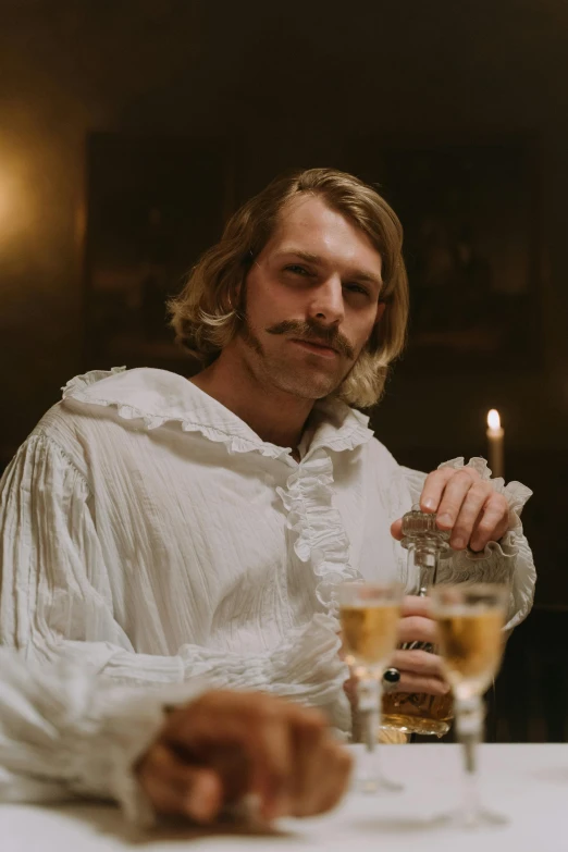 a man in a costume holding a glass and a lighter