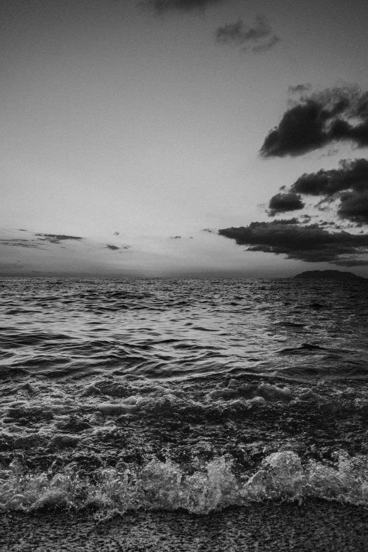 a boat is on the ocean during a sunset