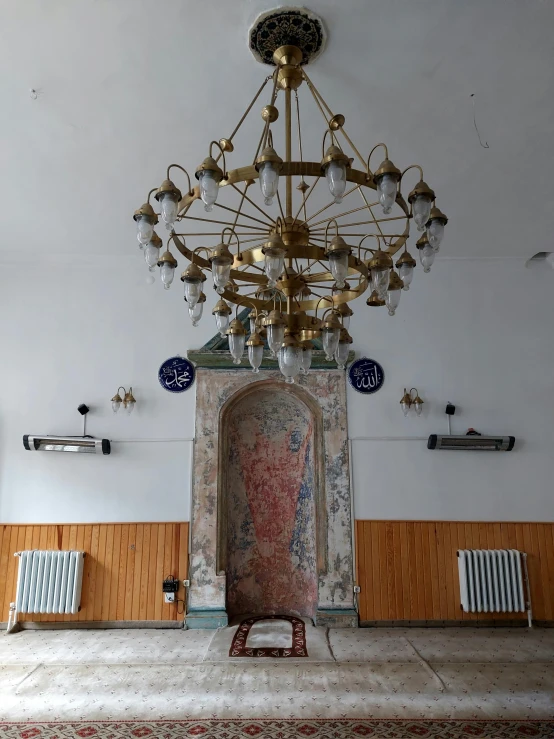 an ornate room with four chandeliers hanging from the ceiling