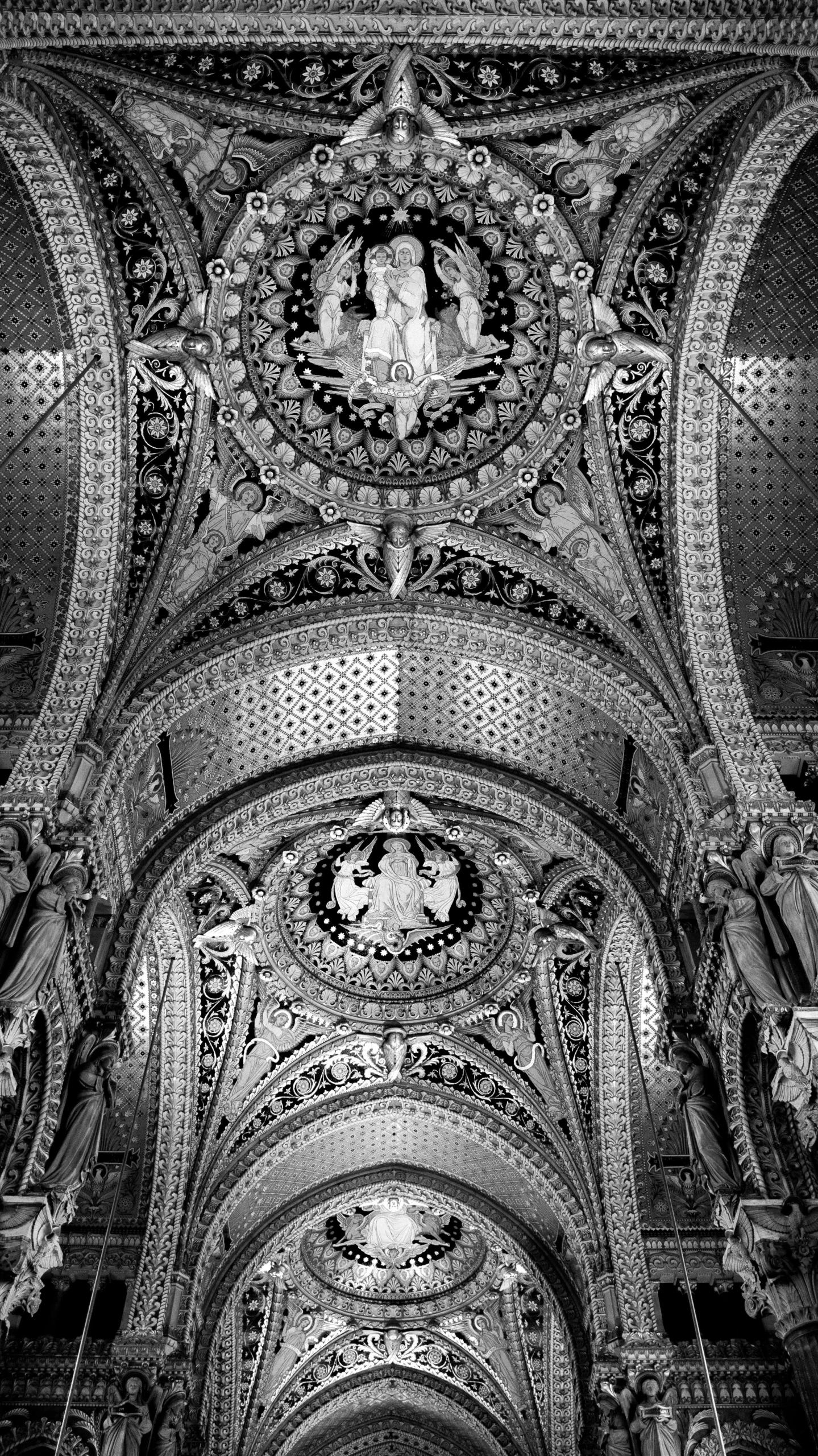 an ornate ceiling in a very large building