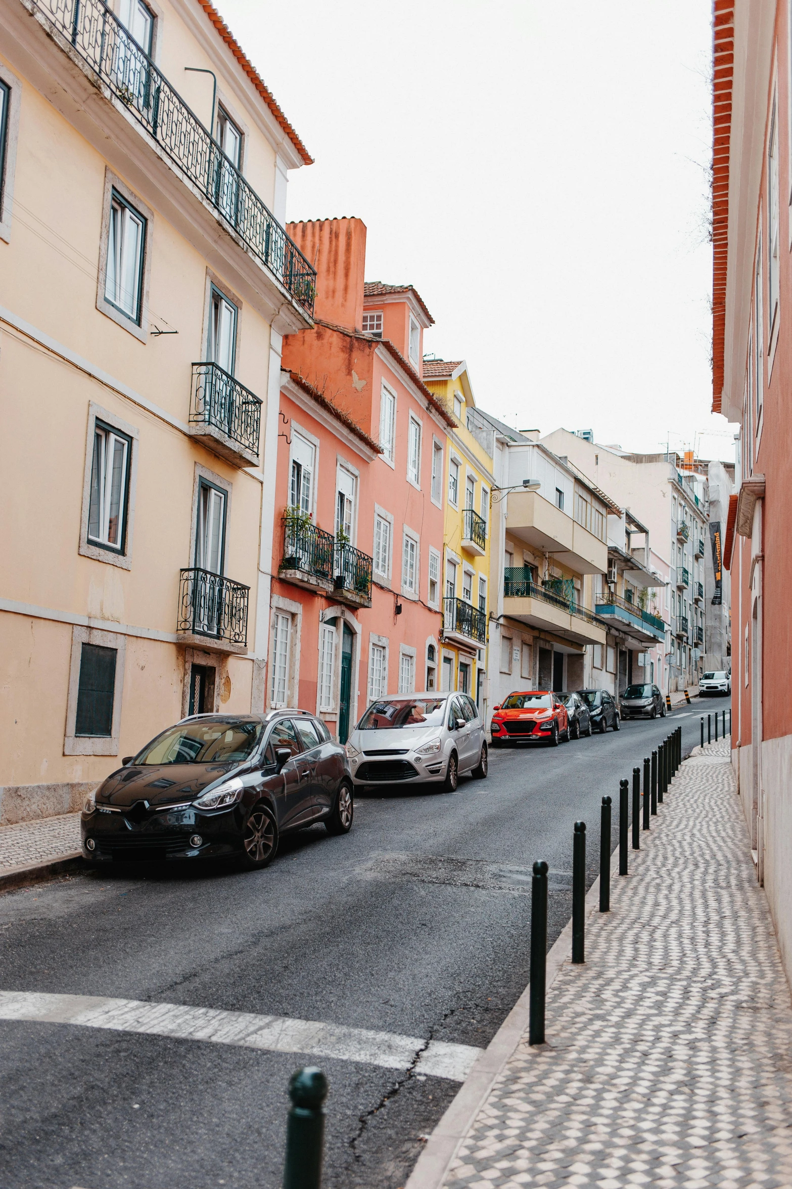 some cars parked in a road and buildings