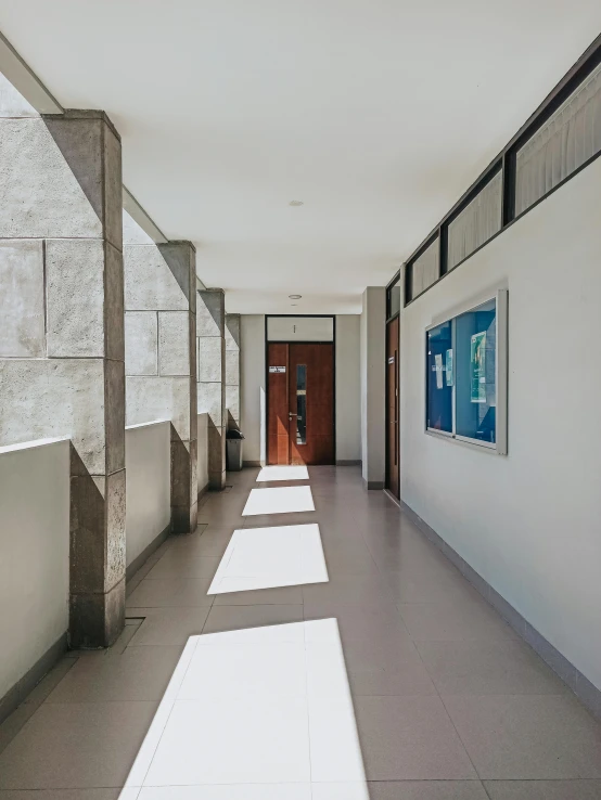 an open hallway with a painting hanging on the wall