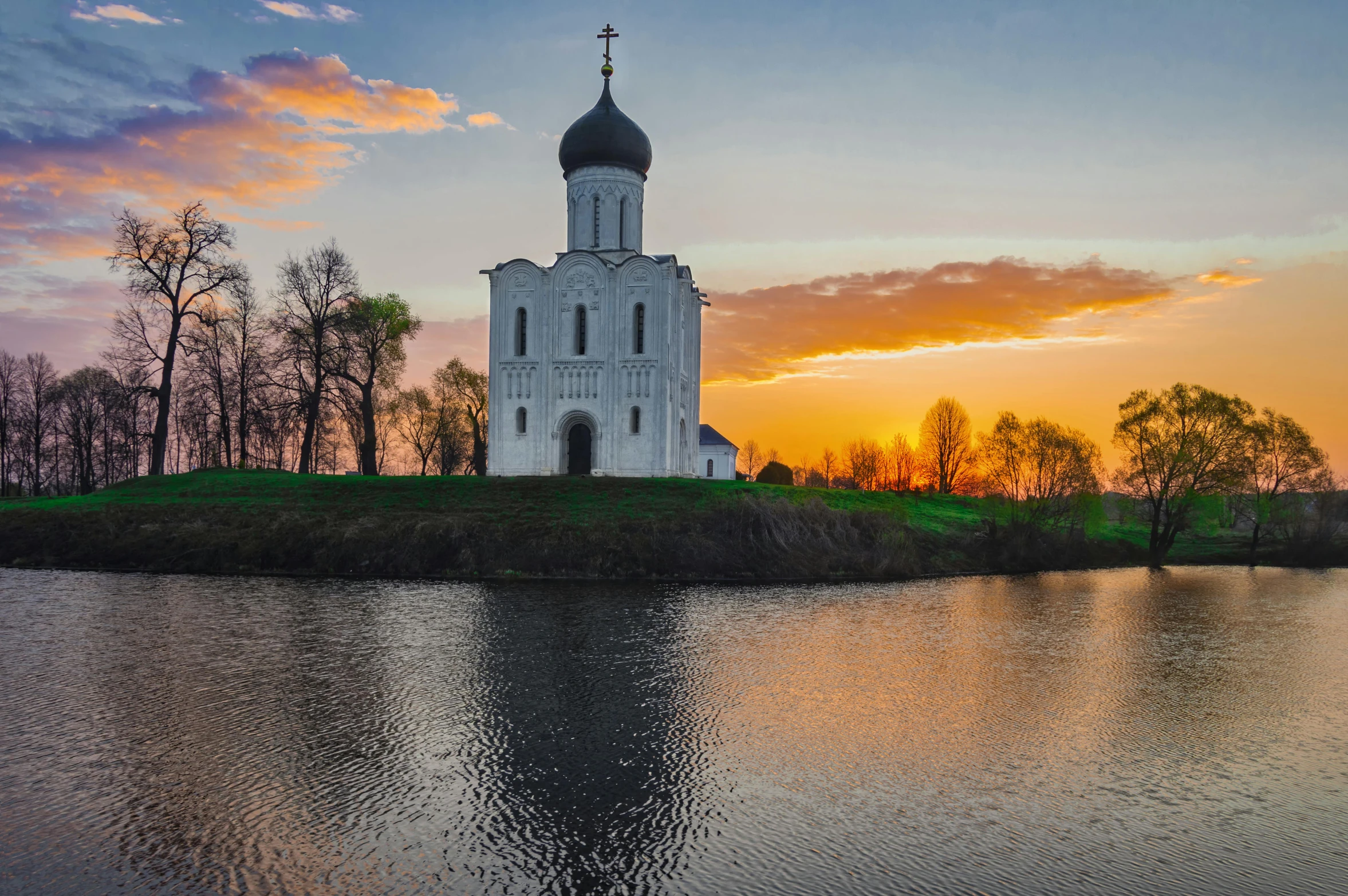 a large building sitting on top of a river