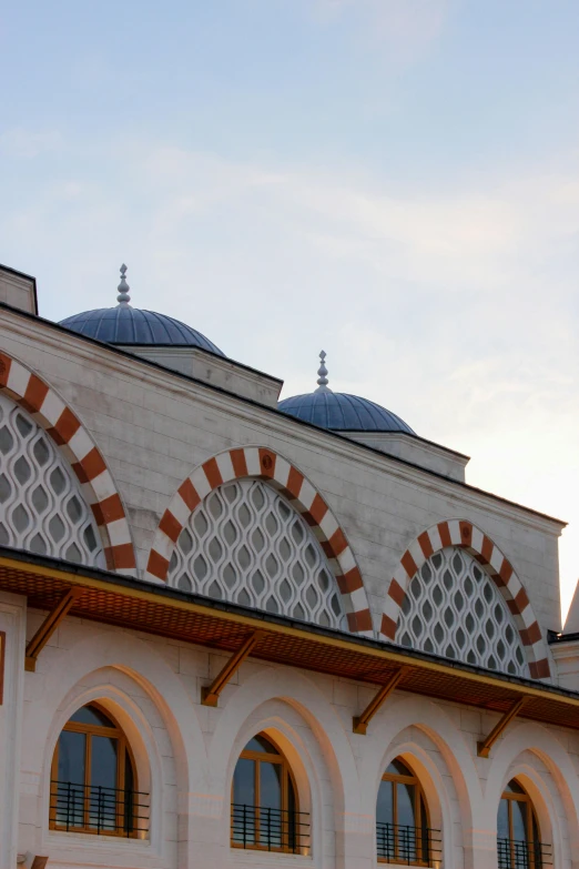 an old building with many windows and arches