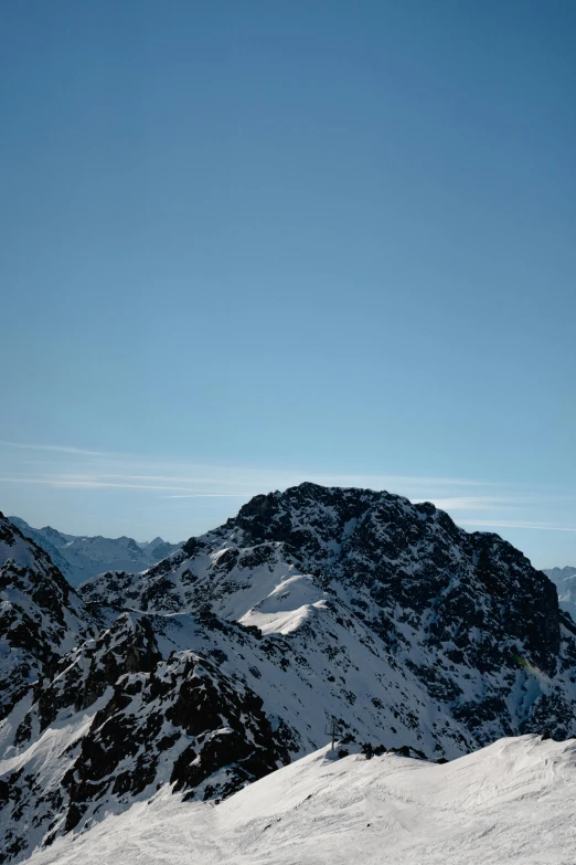 a snowboarder riding down the side of a mountain