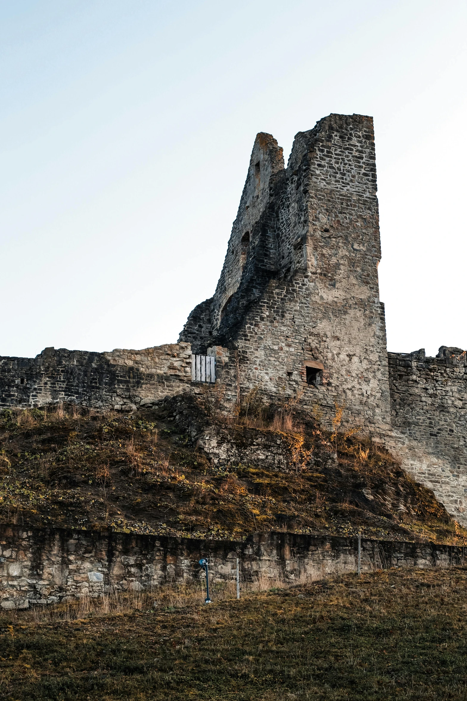 a castle made of rock with a tall stone tower