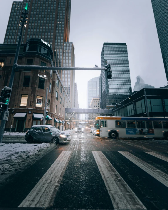 snow is on the ground in an urban city