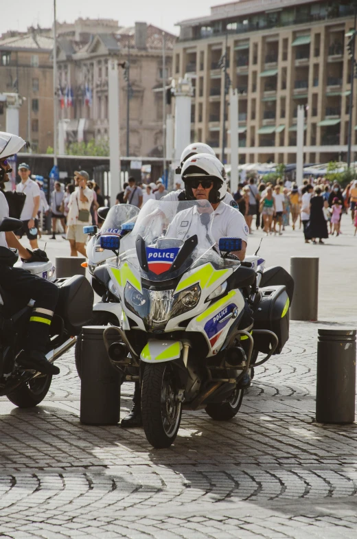 two police men sitting on a motor cycle