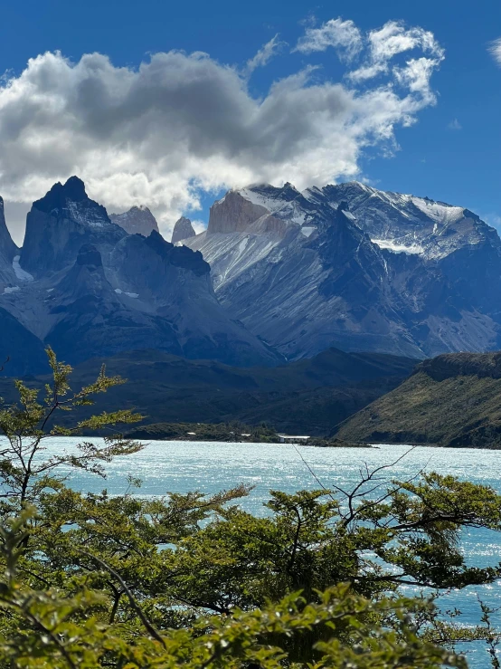 the mountains are majestic in the distance over the water