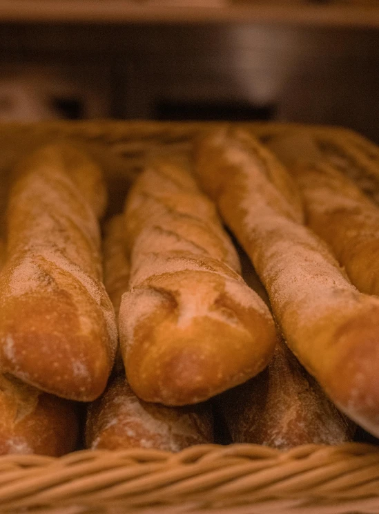 freshly made breads sitting on top of a wicker container